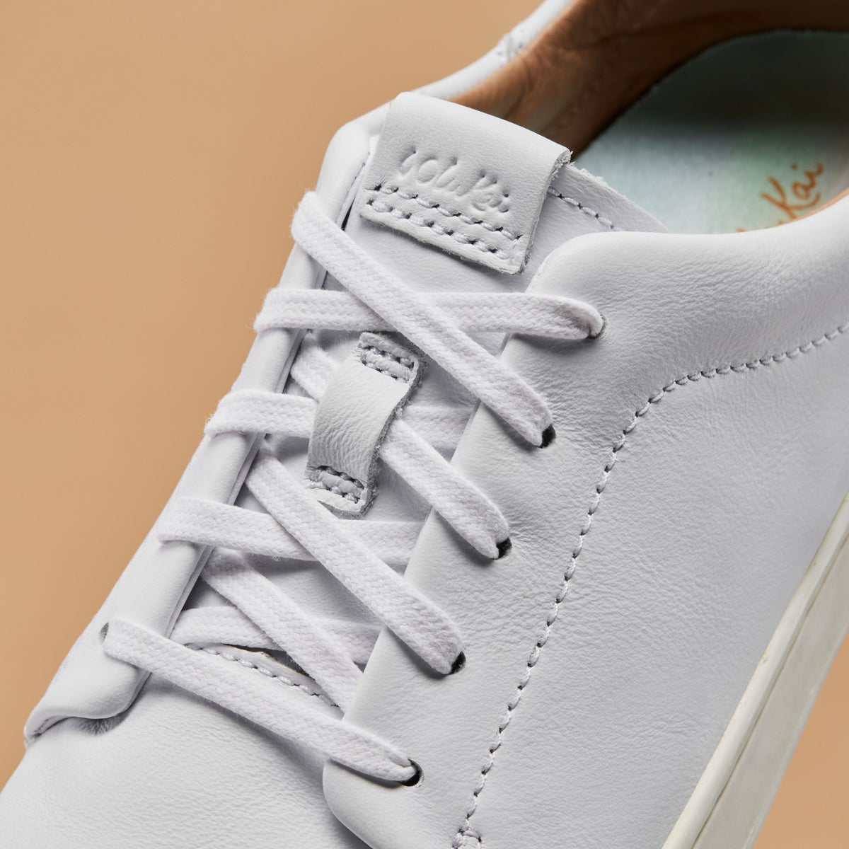 OluKai | Pehuea Lī ‘Ili Women's Leather Sneakers - White