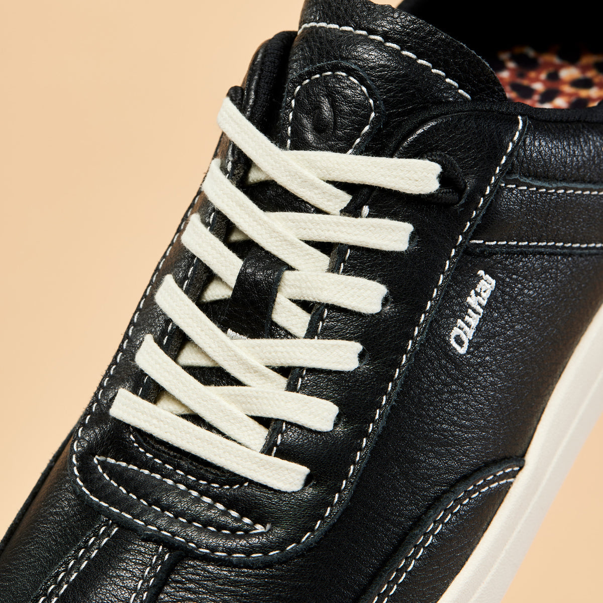 OluKai | Hā‘upu Women’s Leather Sneakers - Onyx