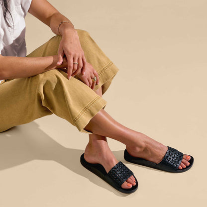 OluKai | Kāmola Women’s Leather Slide Sandals - Black